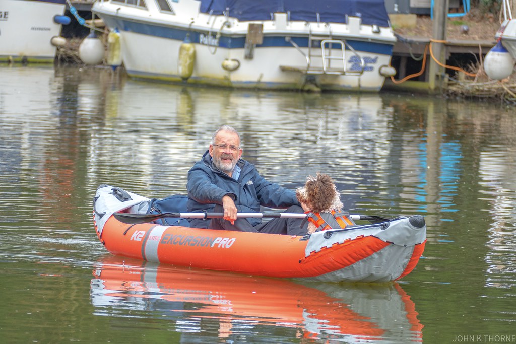 One man and his dog. Inflatable Canoe.